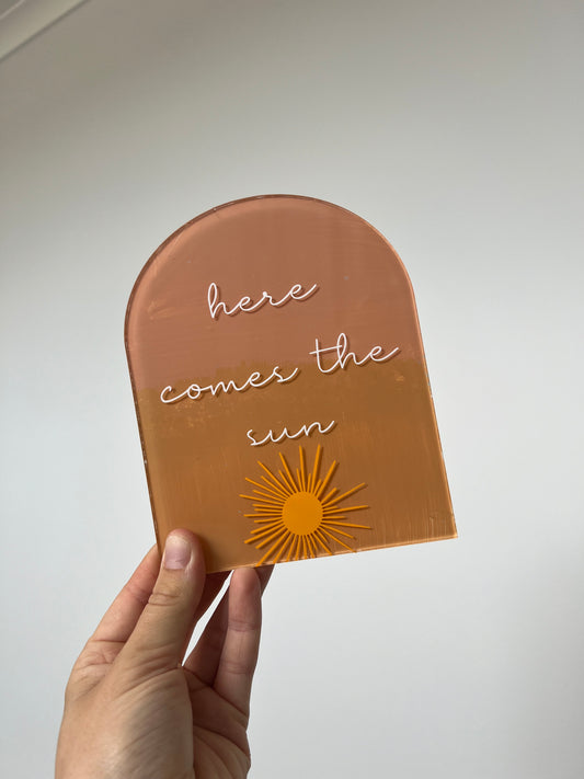 ‘Here comes the sun’ pregnancy announcement