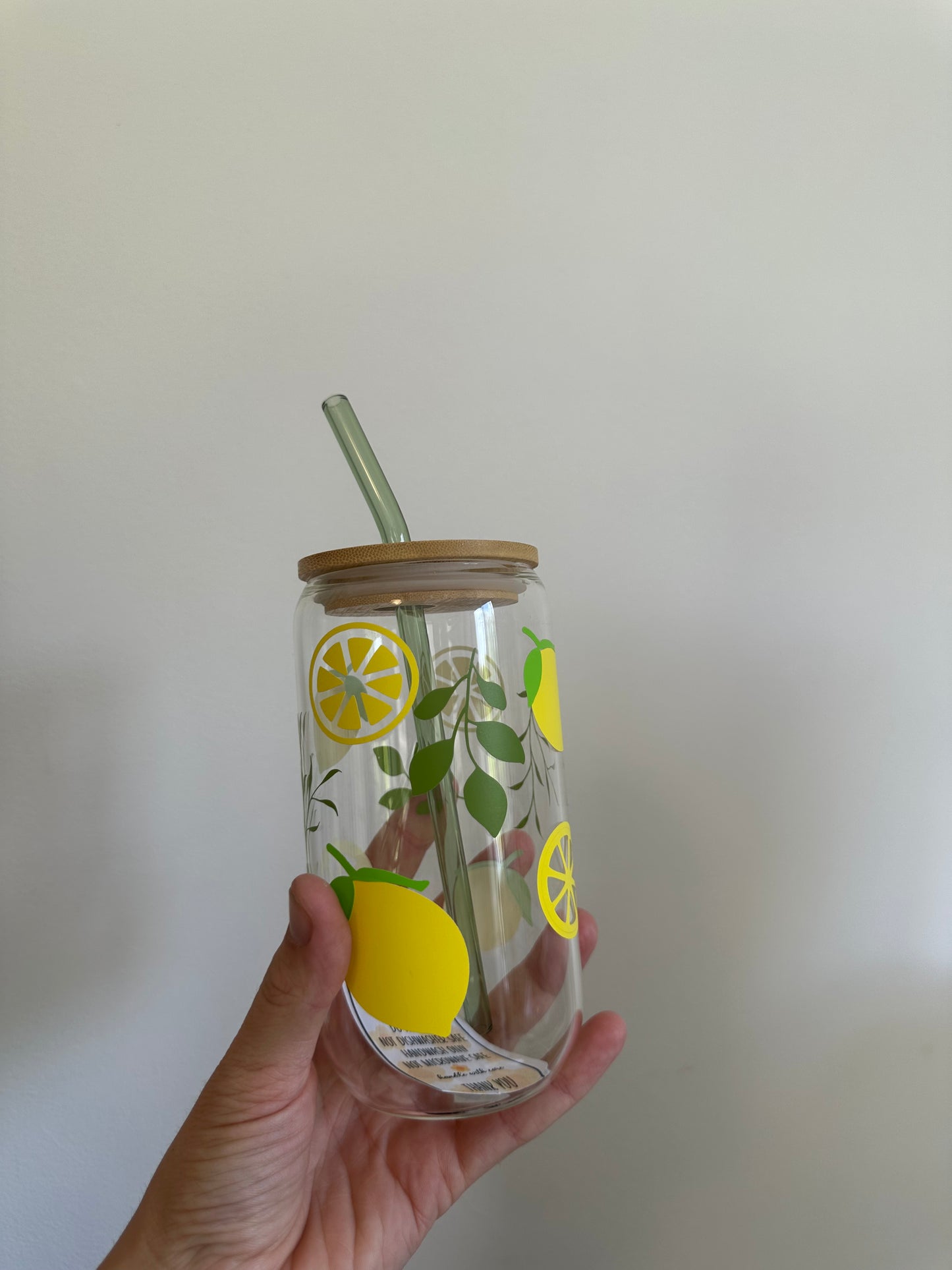 Glass cup with lid and straw