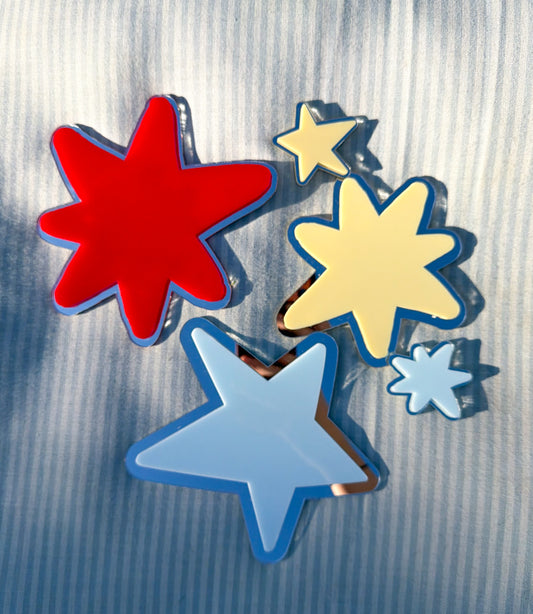 Colorful star-shaped objects on a textured surface