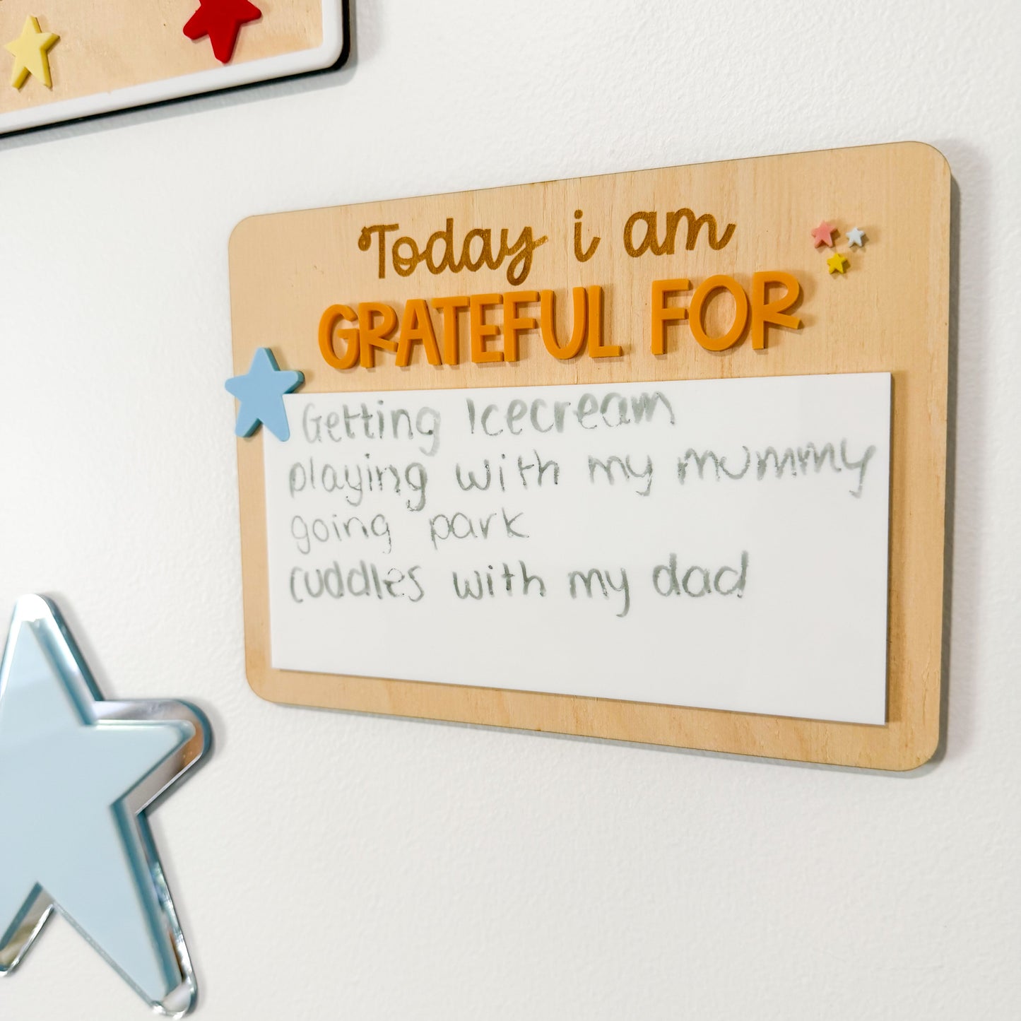 Wooden board with 'Today I am grateful for' text on a white background