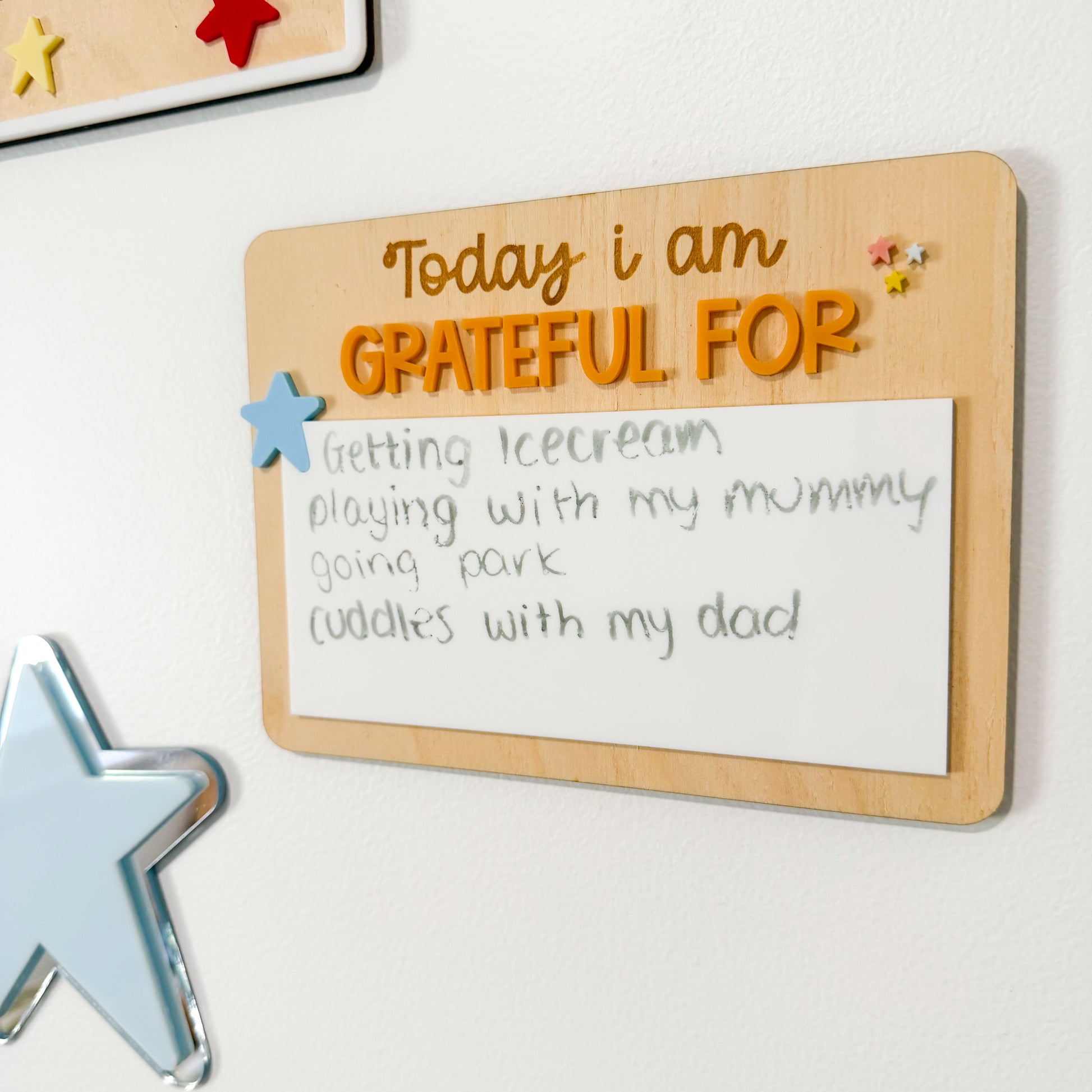 Wooden board with 'Today I am grateful for' text on a white background